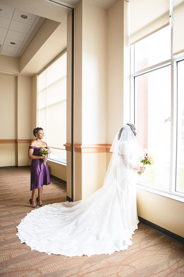 photo of wedding bride and bridesmaid in cross insurance center