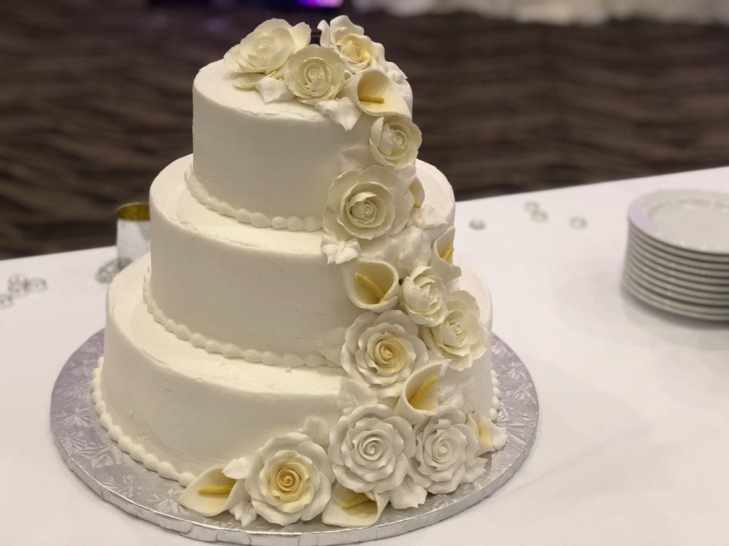 photo of wedding cake in cross insurance center ballroom