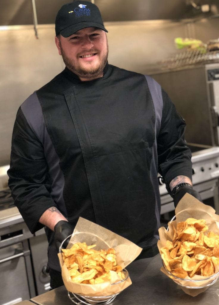 photo of ryan holding baskets of home made chips